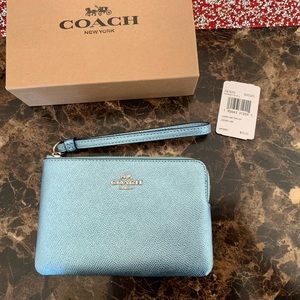 Metallic sky blue coach wristlet . New with tags